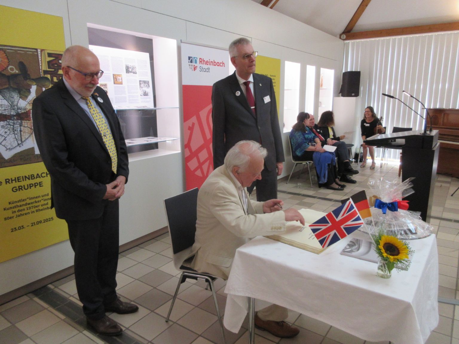 Signing Rheinbach's Golden Book